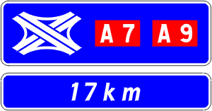 Indication of the distance to an upcoming Autoroute interchange with road numbers.