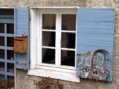 This is photo of a decorative shutters in Trévoux France.